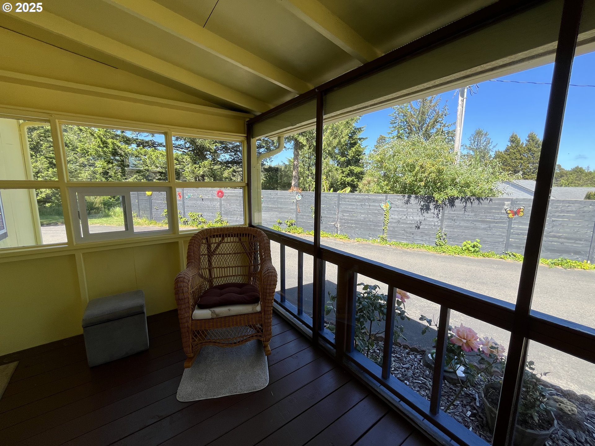 83763 Highway 101, Unit 10 Florence, OR 97439 - Photo 9 of 34 a view of a city from a balcony with furniture