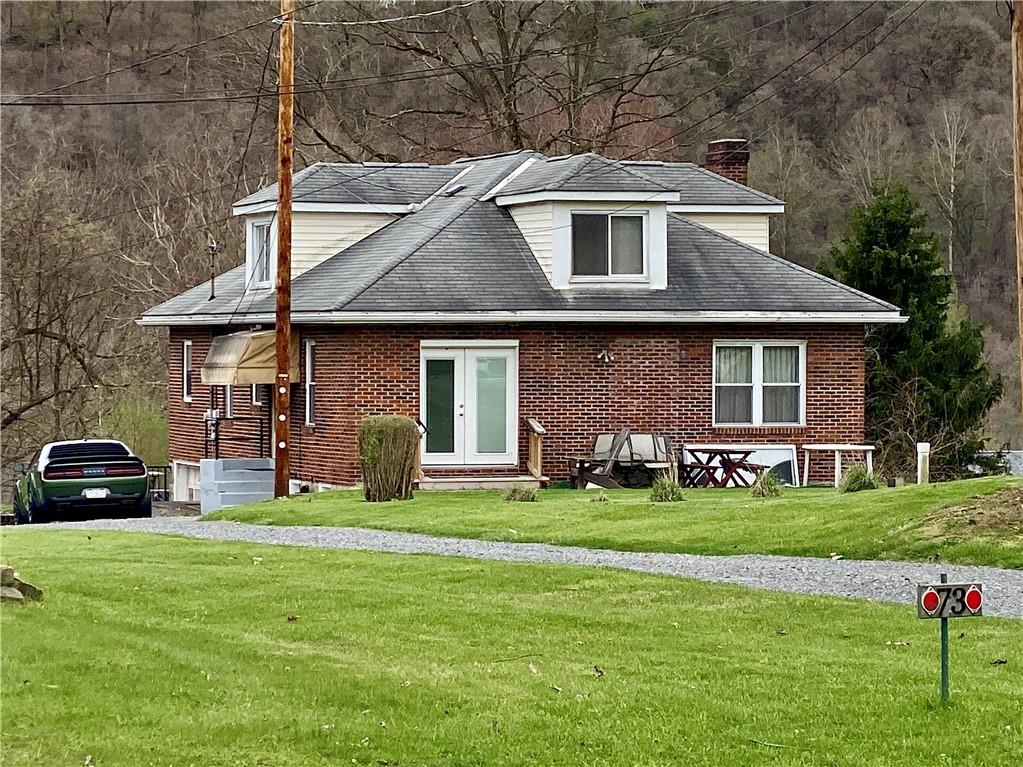 a front view of a house with a yard