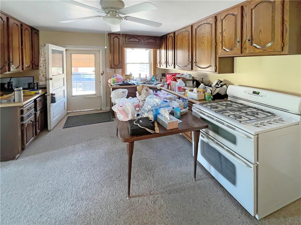 73 Noblestown Road Carnegie, PA 15106 - Photo 5 of 25 a kitchen with a stove a sink and a cabinets