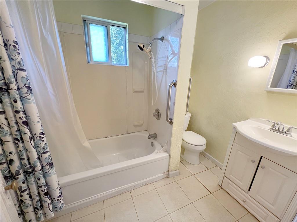 73 Noblestown Road Carnegie, PA 15106 - Photo 8 of 25 a bath room with a toilet and a bath tub