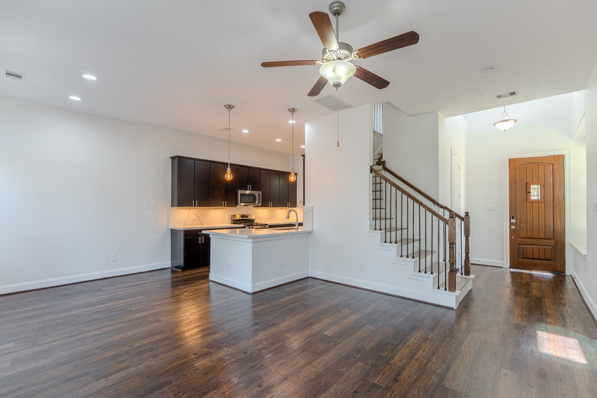58 Aventura Place Spring, TX 77389 - Photo 15 of 50 a view of room with wooden floor and ceiling fan