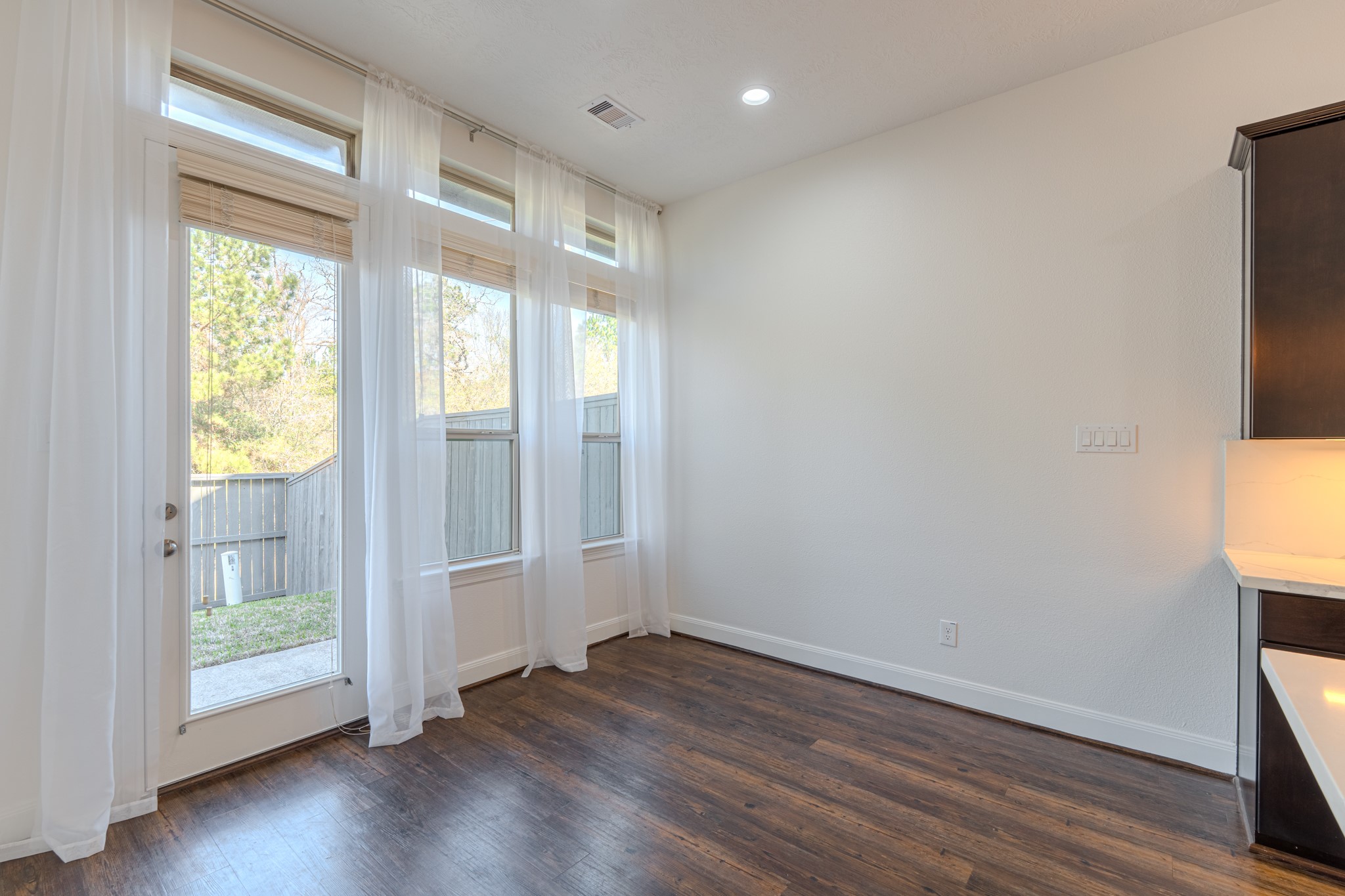 58 Aventura Place Spring, TX 77389 - Photo 20 of 50 an empty room with wooden floor and windows
