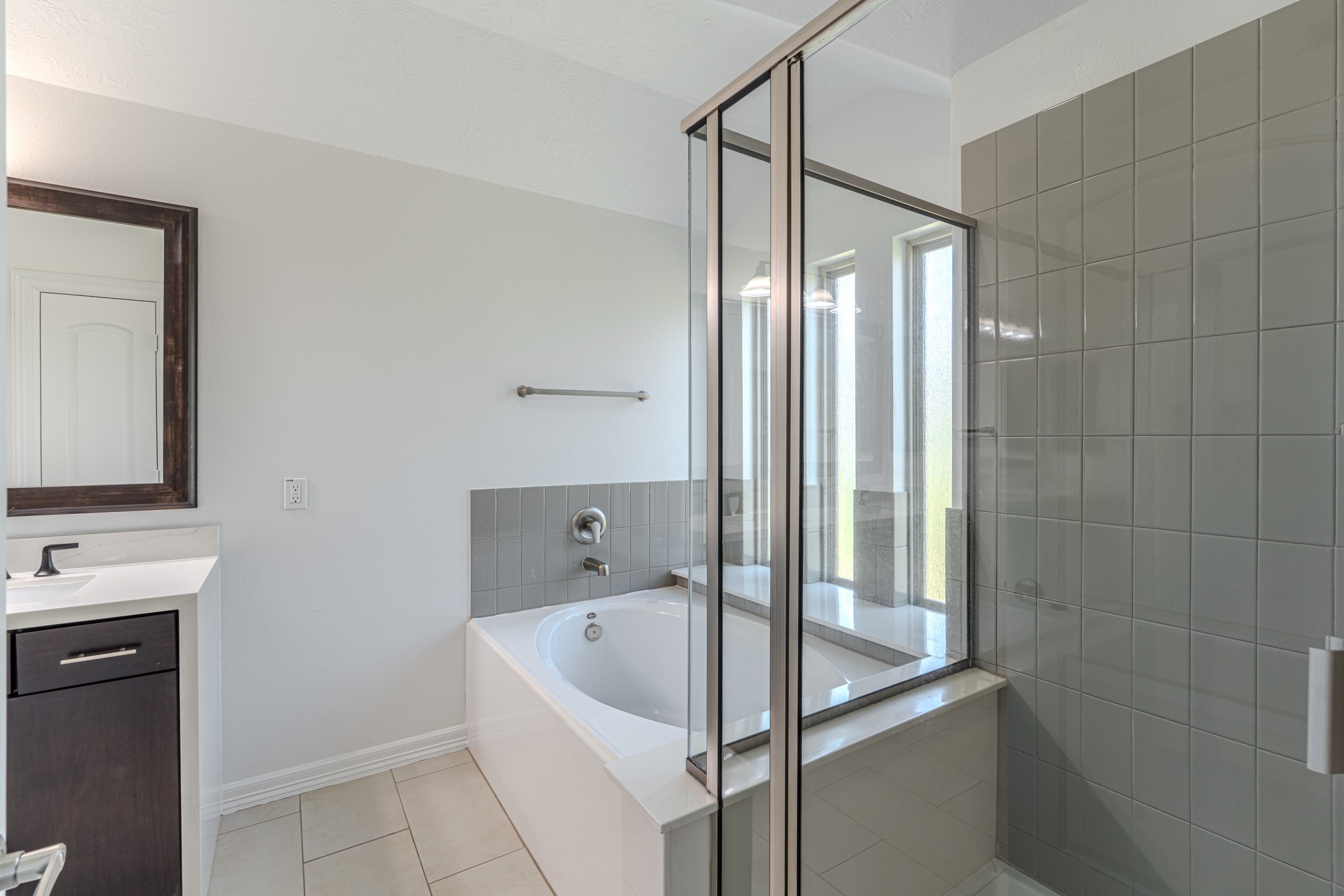 58 Aventura Place Spring, TX 77389 - Photo 34 of 50 a bathroom with a bathtub and a sink