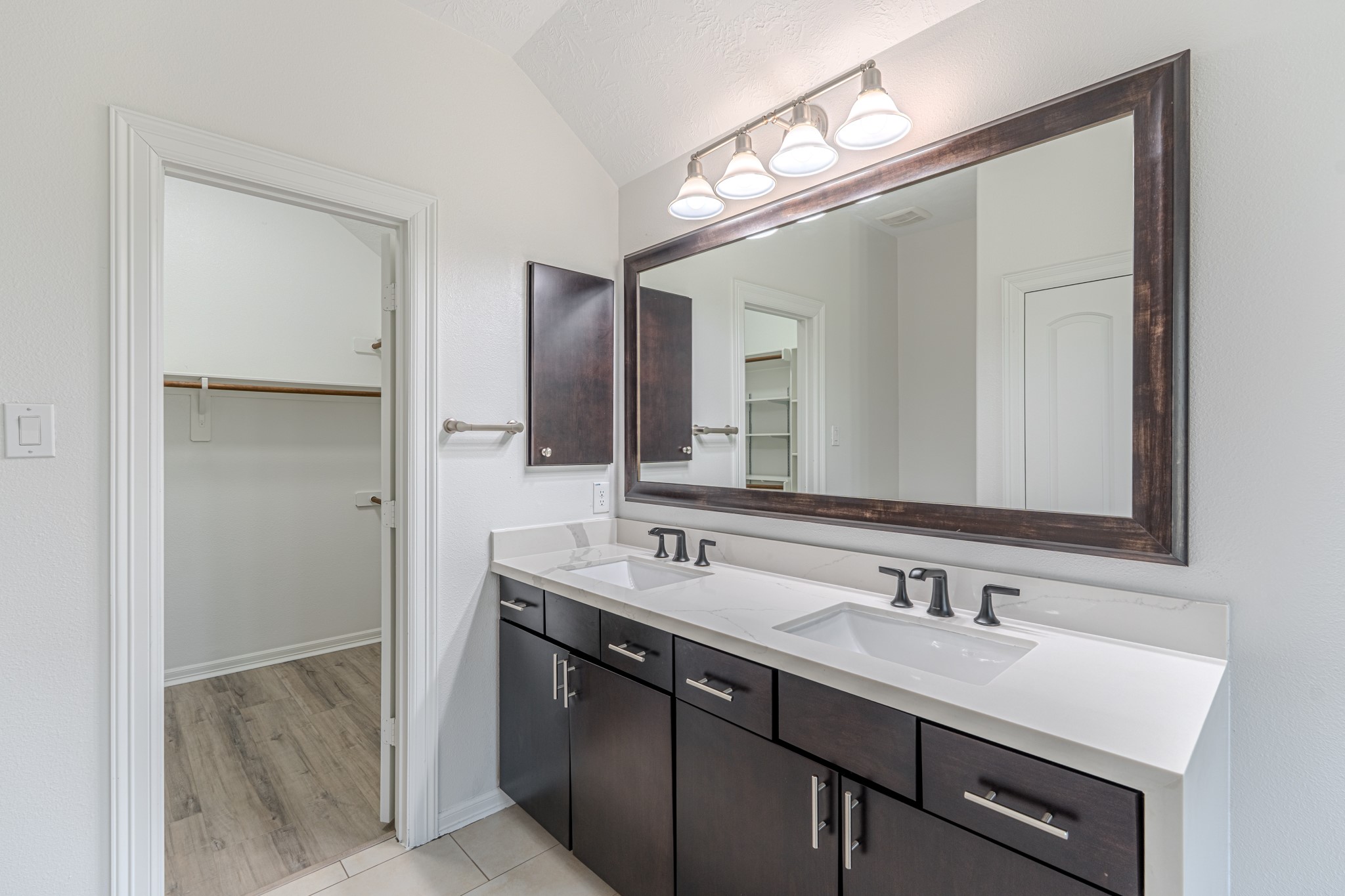 58 Aventura Place Spring, TX 77389 - Photo 35 of 50 a bathroom with a sink double vanity and a mirror
