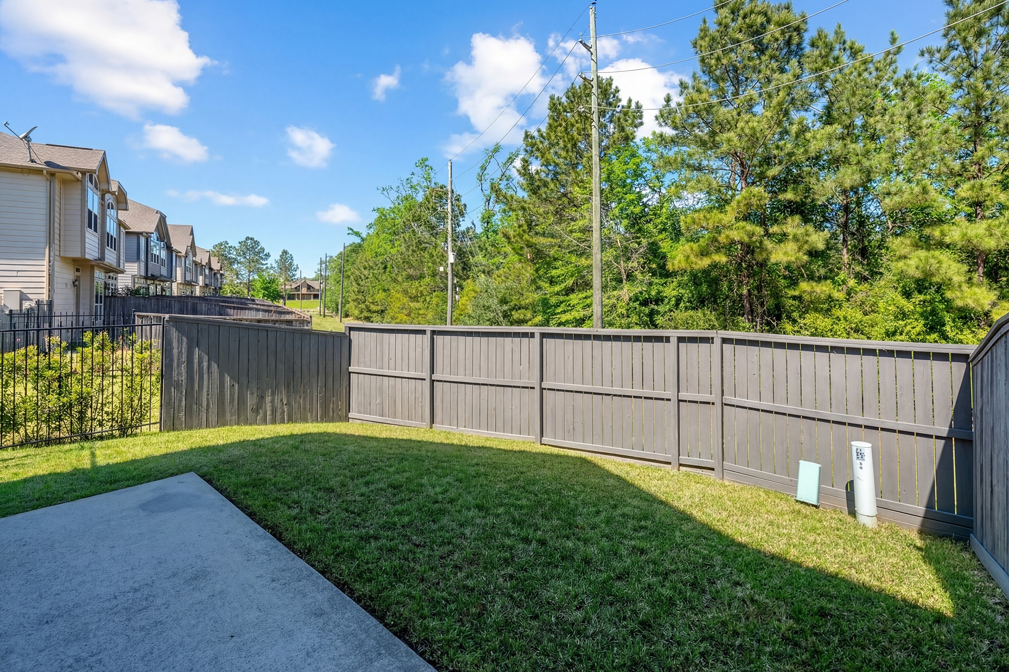 58 Aventura Place Spring, TX 77389 - Photo 46 of 50 a view of a backyard with a fence and plants