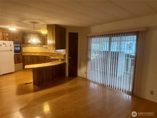 a view of a kitchen with a sink