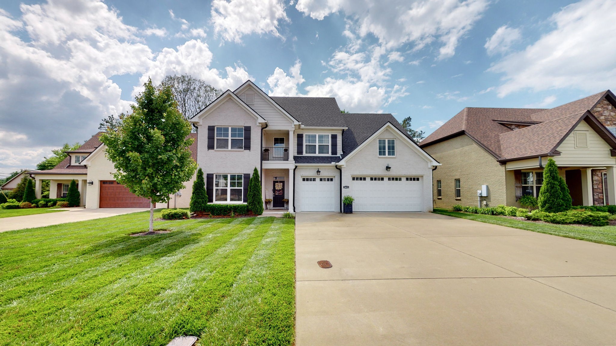 a view of house with yard in front of it