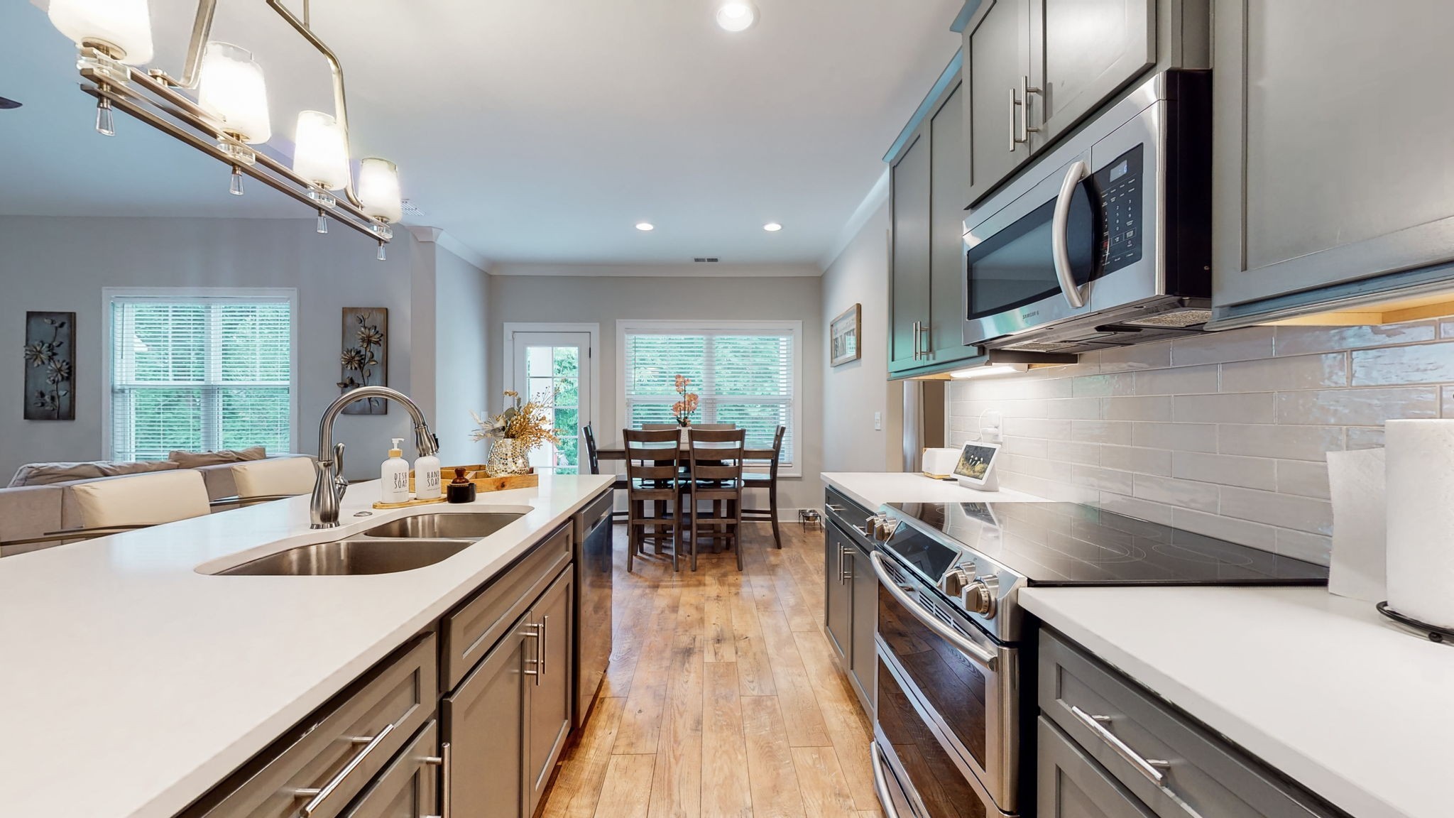 3413 Pershing Drive Murfreesboro, TN 37129 - Photo 11 of 43 a kitchen with counter top space a sink and stainless steel appliances