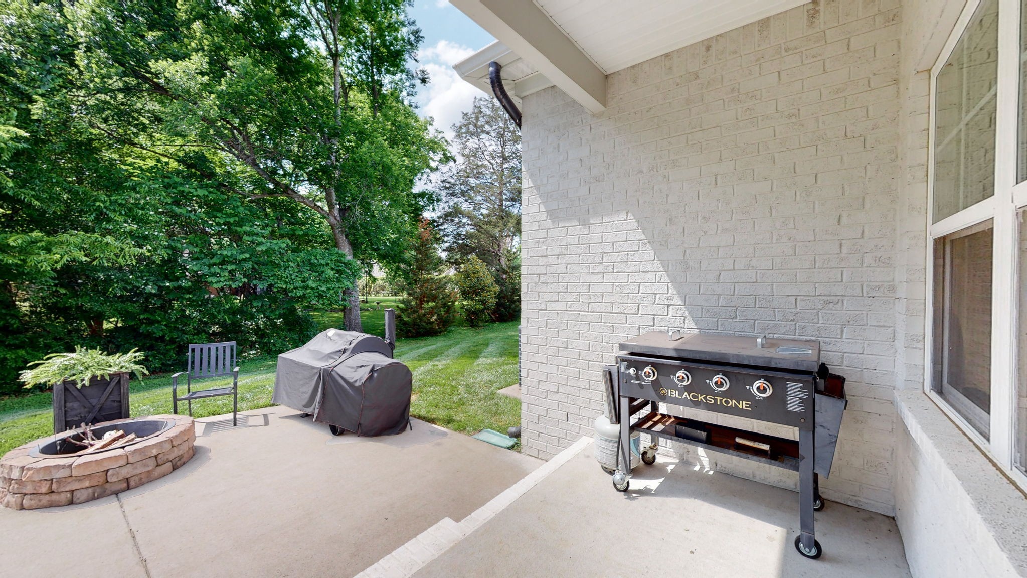 3413 Pershing Drive Murfreesboro, TN 37129 - Photo 40 of 43 a backyard of a house with fire pit and outdoor seating