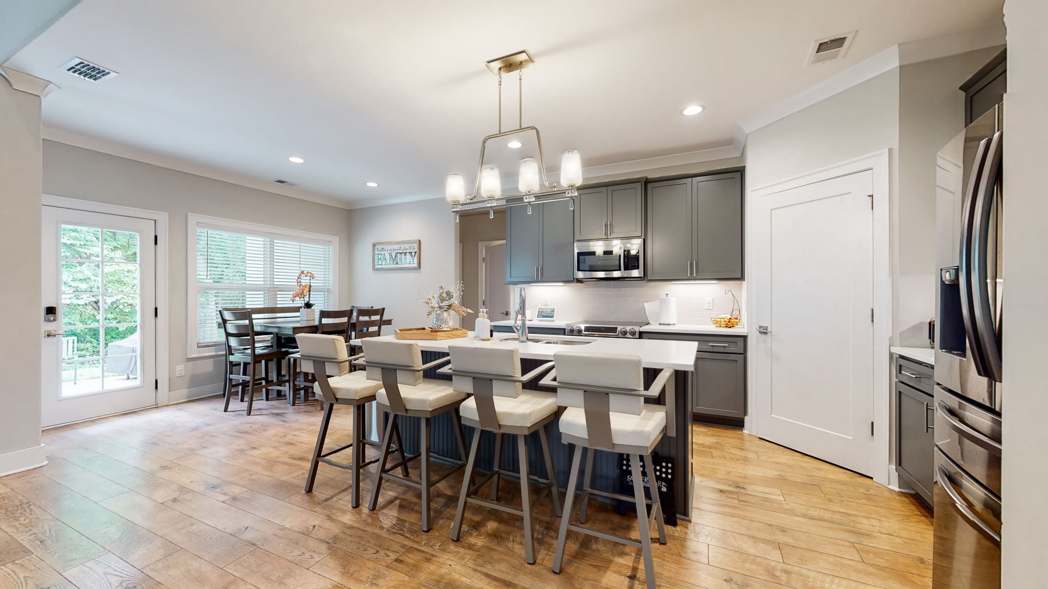 3413 Pershing Drive Murfreesboro, TN 37129 - Photo 10 of 43 a kitchen with stainless steel appliances granite countertop a dining table chairs refrigerator and sink