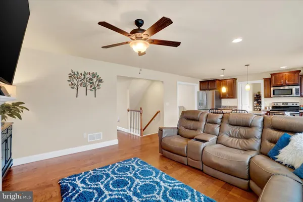 a living room with furniture and a rug