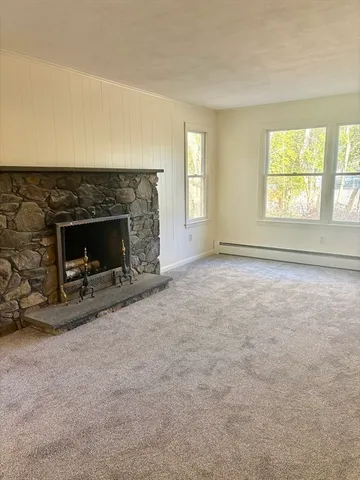 a view of room with window and hardwood