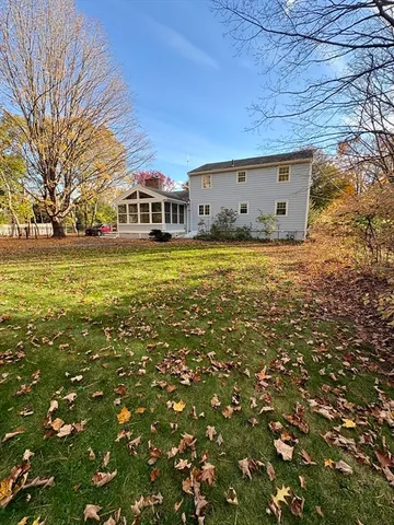 a view of a house with a yard