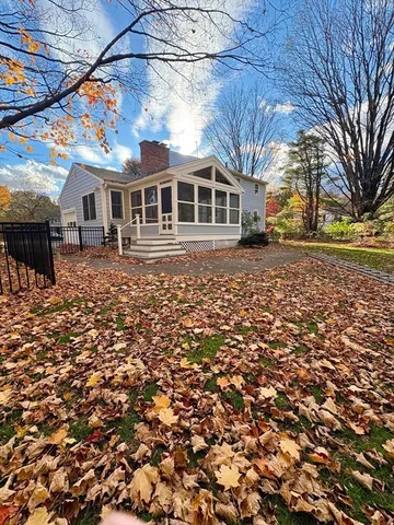 a front view of house with yard and seating area
