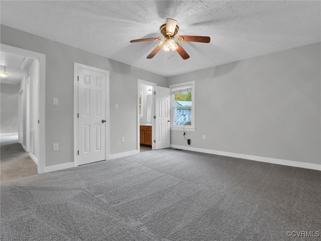 3304 Rufford Place Chester, VA 23831 - Photo 20 of 26 an empty room with chandelier fan and windows