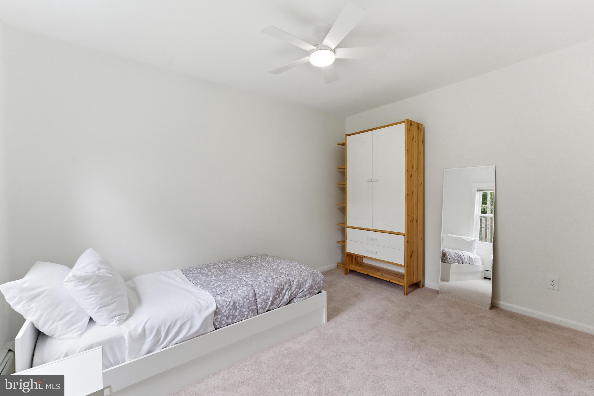 2100 Edgewater Parkway Silver Spring, MD 20903 - Photo 27 of 46 a bedroom with a bed and a ceiling fan