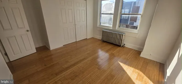 a view of a house with wooden floor and windows