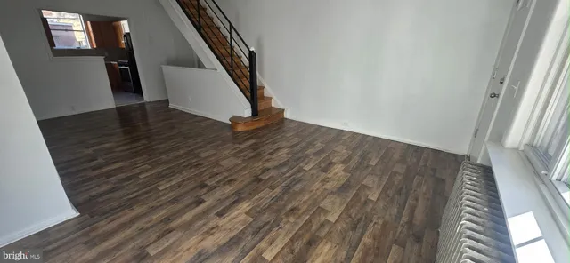 an entryway in a house with wooden floor