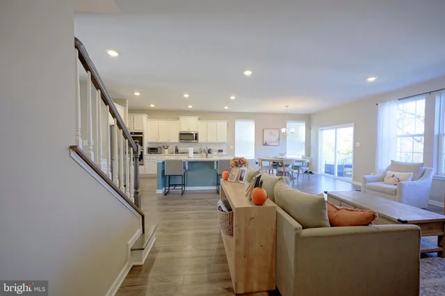 a view of a livingroom with workspace and a window