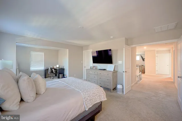 a workspace with furniture and a window