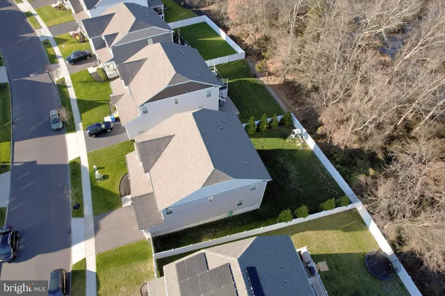 an aerial view of house with a yard