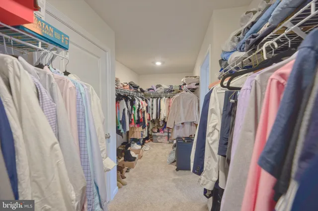 a bathroom with a double vanity sink mirror and shower