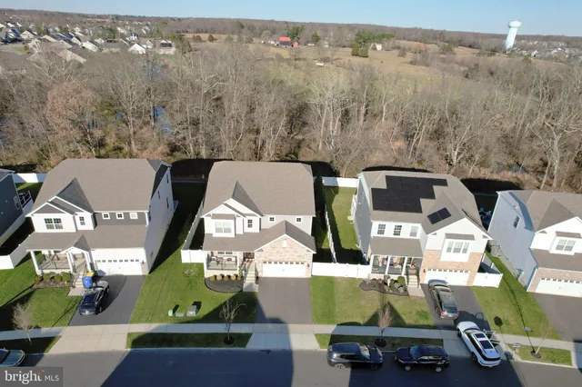 an aerial view of houses with outdoor space