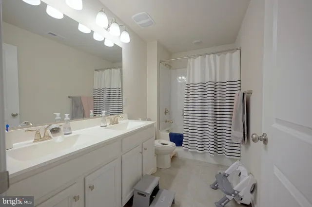 a view of a room with furniture and toys