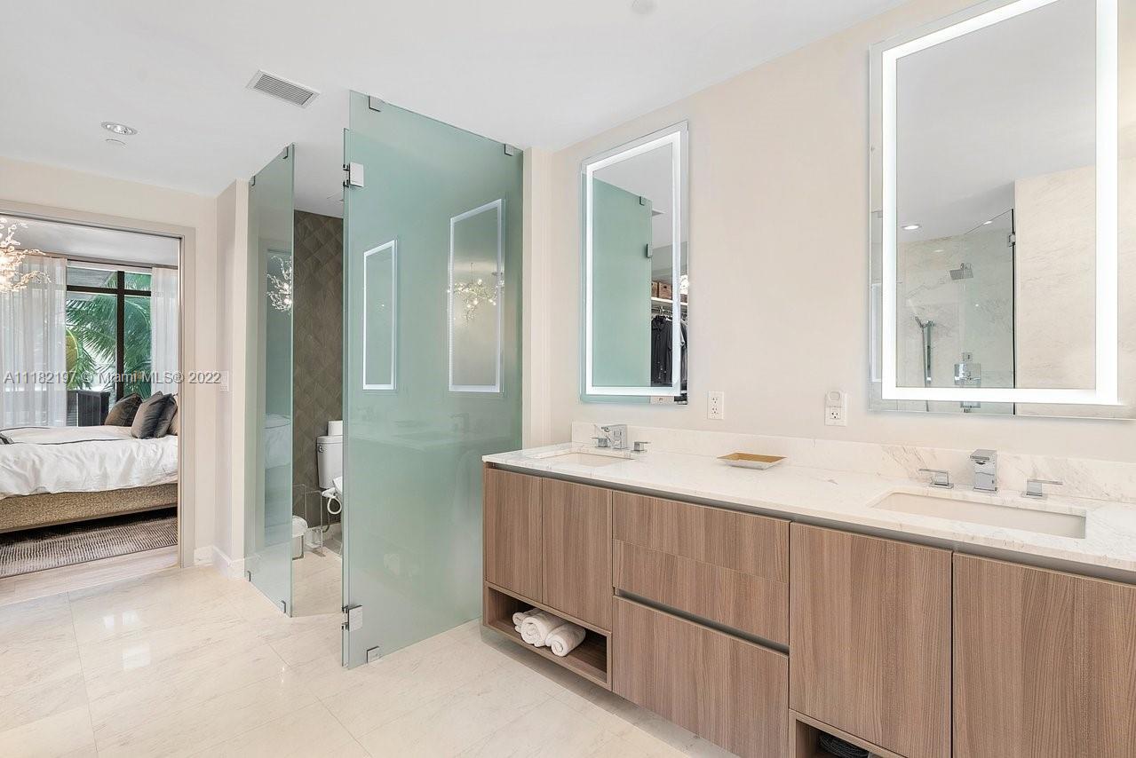 2101 South Surf Road, Unit 2C Hollywood, FL 33019 - Photo 19 of 38 a en suite bathroom with a double vanity sink and mirror