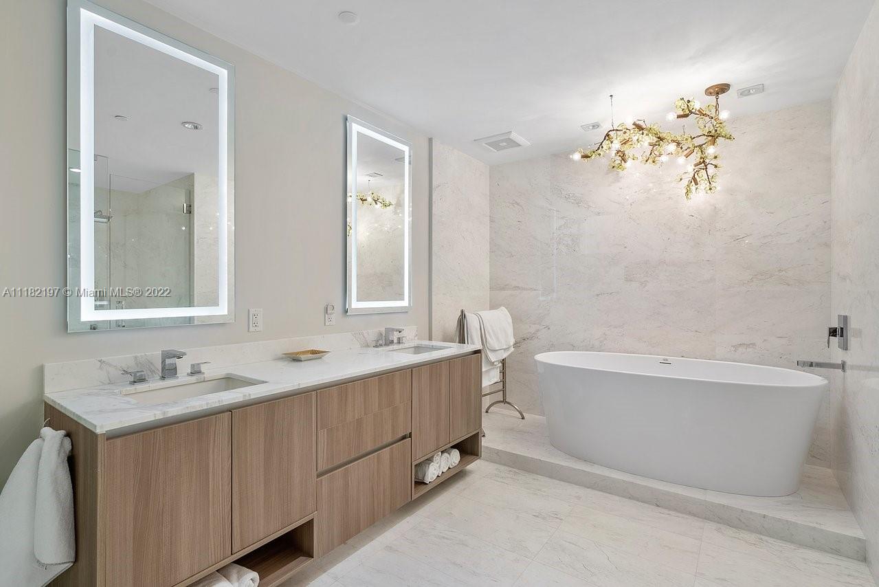 2101 South Surf Road, Unit 2C Hollywood, FL 33019 - Photo 21 of 38 a bathroom with a tub sink double and mirror