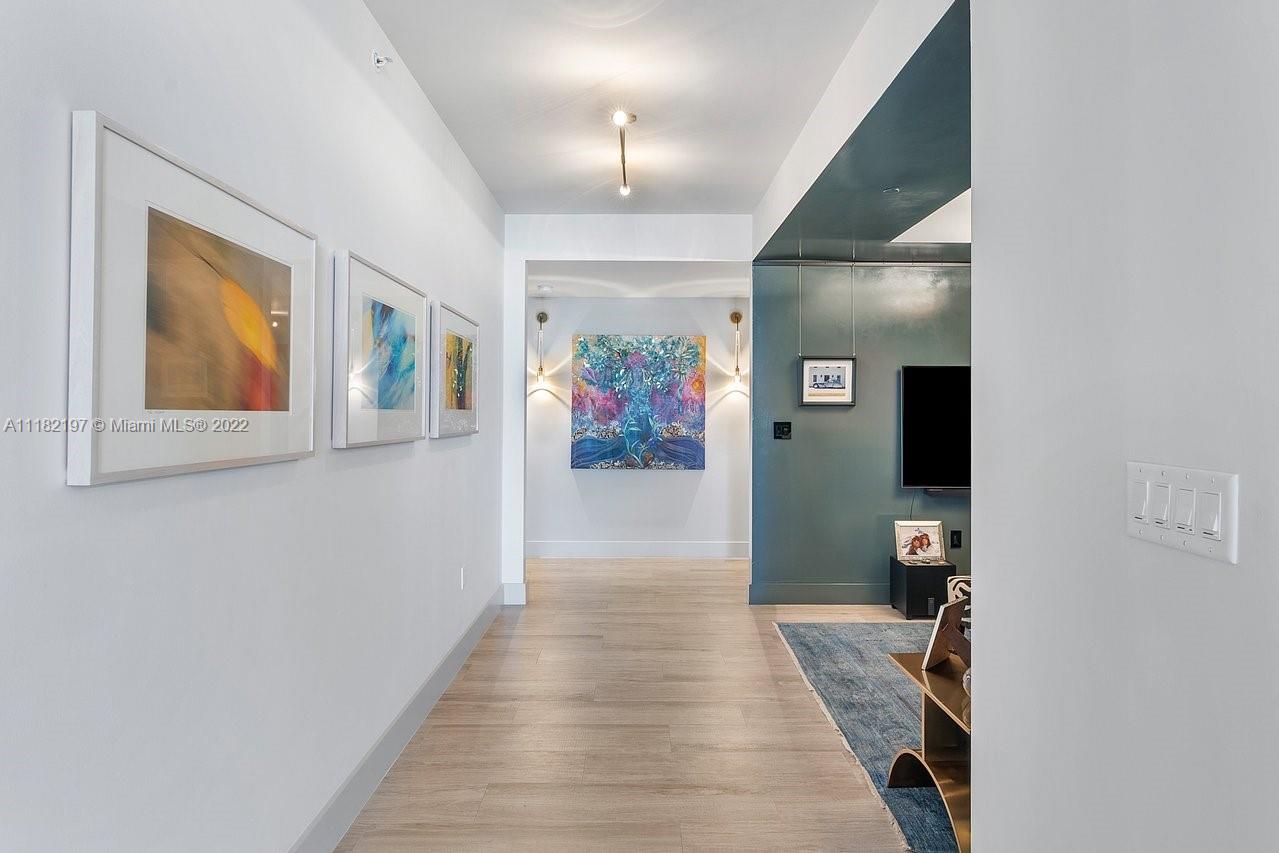 2101 South Surf Road, Unit 2C Hollywood, FL 33019 - Photo 3 of 38 a view of a hallway with wooden floor and entryway