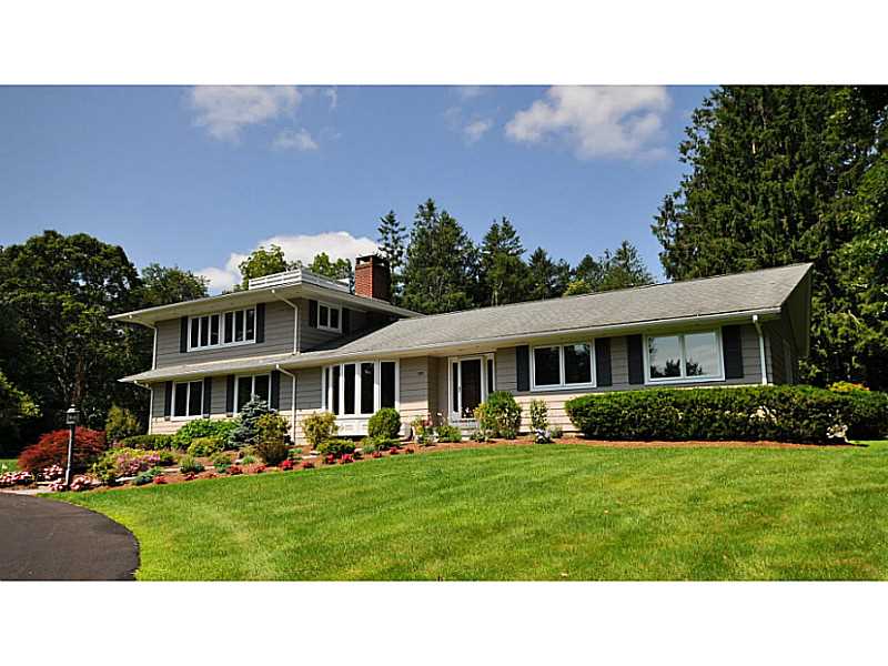 Exterior Front. "Whispering Pines" as this home is affectionately called by its one owner family offers 4070 square feet of gracious living space.
