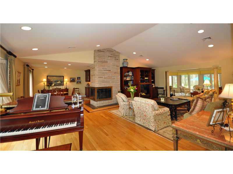 385 Ocean Road Narragansett, RI 02882 - Photo 4 of 25 Den/Family/Great Room. Wow! The 28 x 17 Great Room sets the tone for this elegant home with its cathedral ceiling, gleaming hardwood floors, 3 sided gas fireplace & recessed lighting.