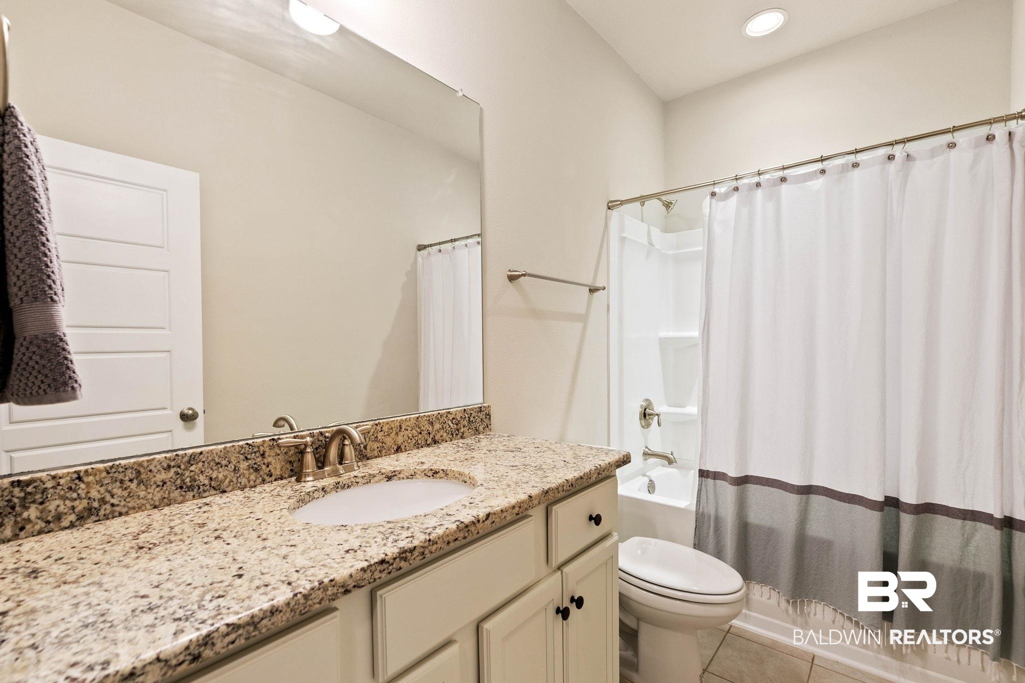 12750 B Jenkins Pit Road Daphne, AL 36527 - Photo 43 of 89 Bathroom featuring vanity, shower / bathtub combination with curtain, recessed lighting, and light tile patterned floors
