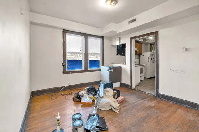 a living room with furniture and large window