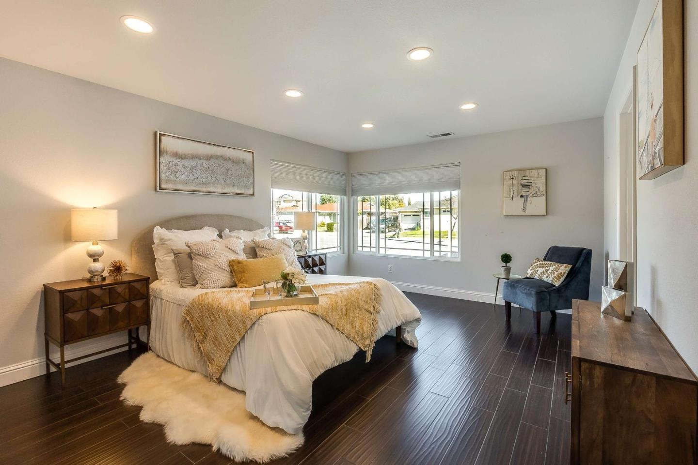 36045 Haley Street Newark, CA 94560 - Photo 15 of 26 a bedroom with bed and a desk