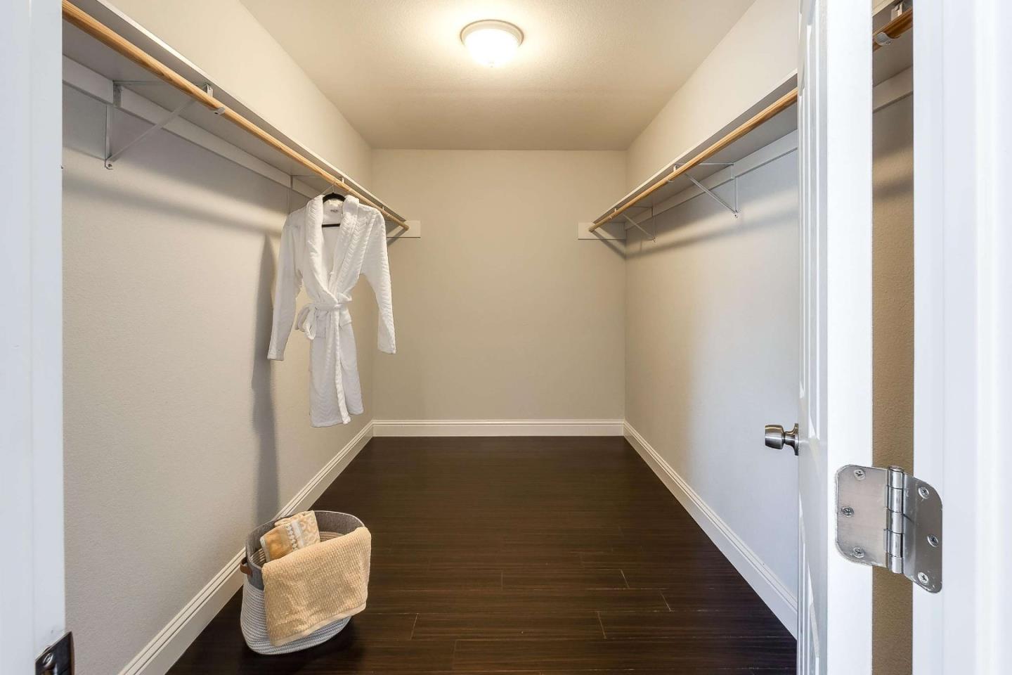 36045 Haley Street Newark, CA 94560 - Photo 18 of 26 a view of water heater room with wooden floor