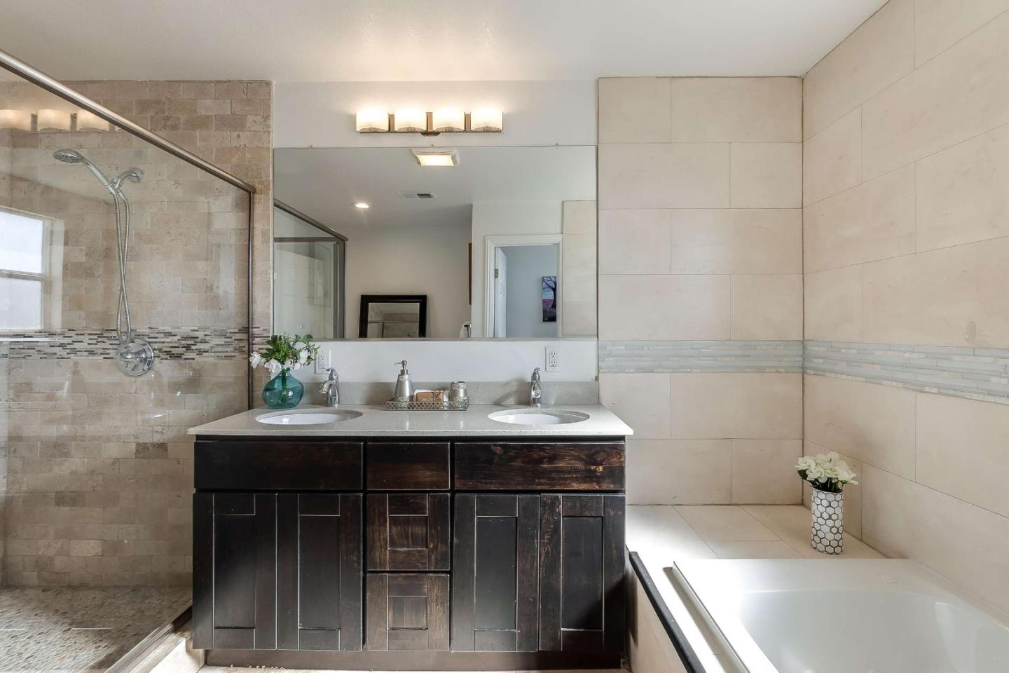 36045 Haley Street Newark, CA 94560 - Photo 20 of 26 a bathroom with a sink and a mirror