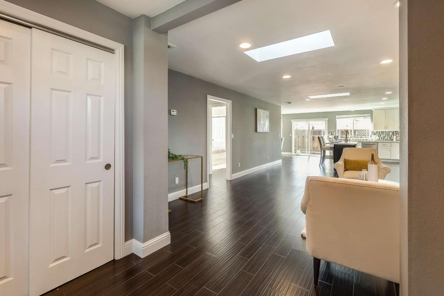 36045 Haley Street Newark, CA 94560 - Photo 3 of 26 a living room with furniture and a wooden floor