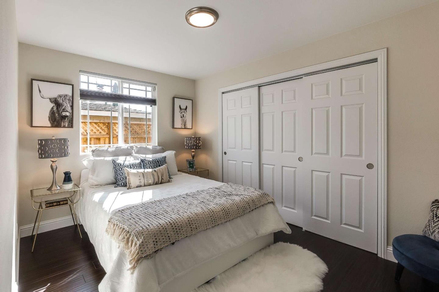 36045 Haley Street Newark, CA 94560 - Photo 24 of 26 a bedroom with a bed and a window
