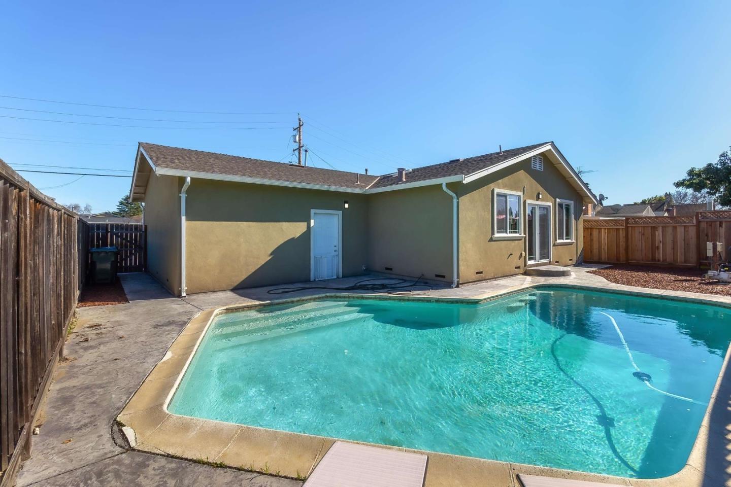 36045 Haley Street Newark, CA 94560 - Photo 25 of 26 a backyard of a house with seating space