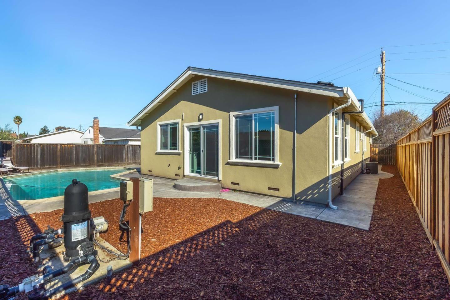 36045 Haley Street Newark, CA 94560 - Photo 26 of 26 a view of a house with backyard and porch
