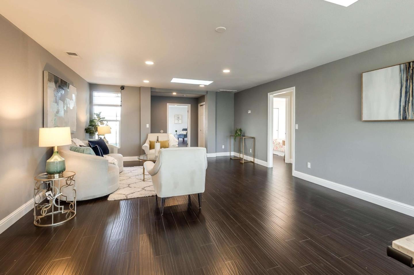 36045 Haley Street Newark, CA 94560 - Photo 5 of 26 a living room with furniture and wooden floor
