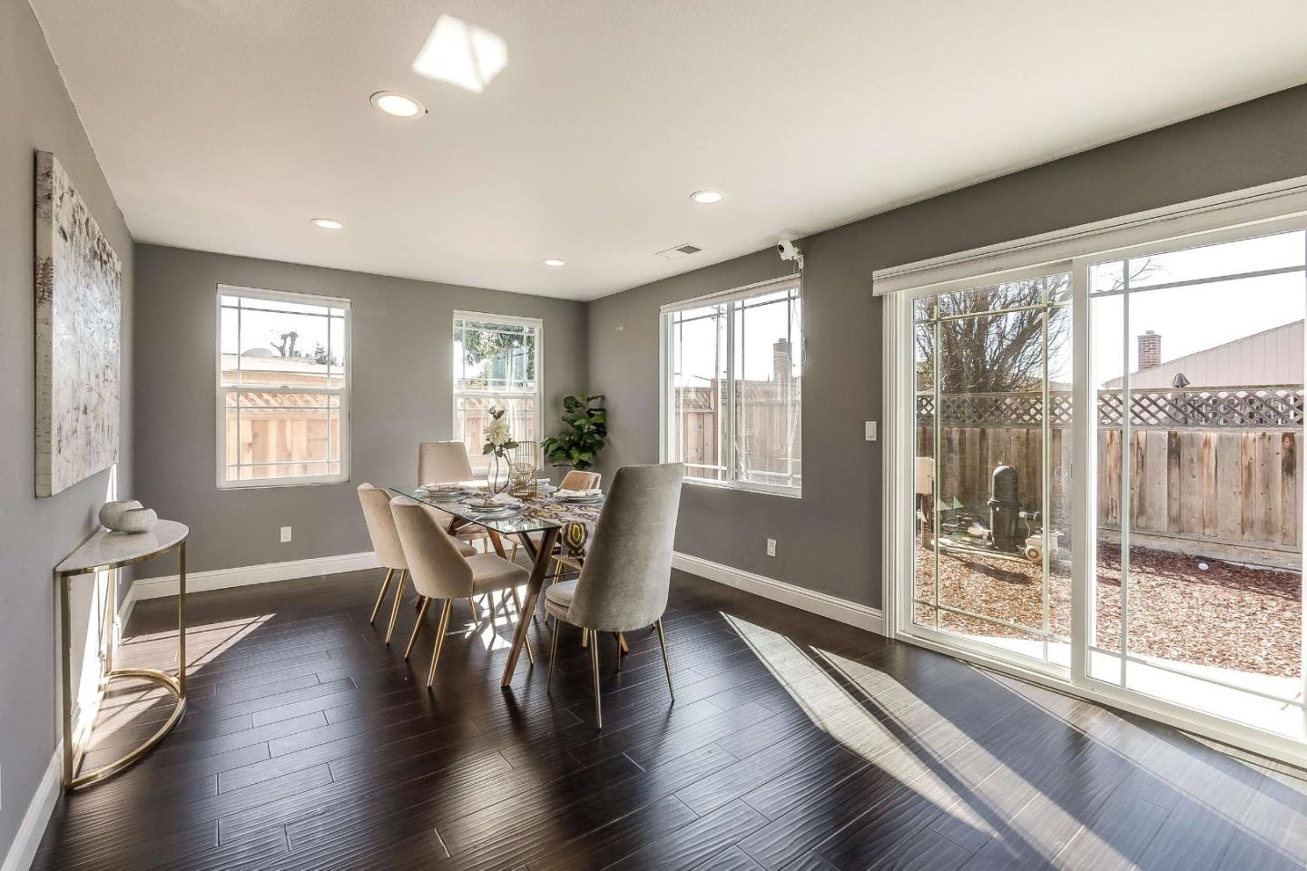 36045 Haley Street Newark, CA 94560 - Photo 6 of 26 a view of a dining room with furniture and wooden floor