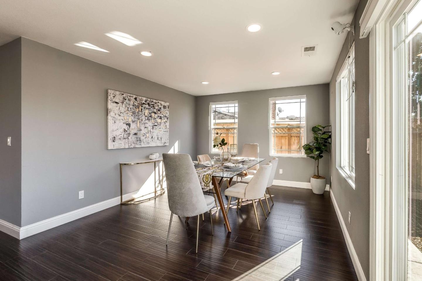 36045 Haley Street Newark, CA 94560 - Photo 7 of 26 a view of a dining room with furniture window and wooden floor
