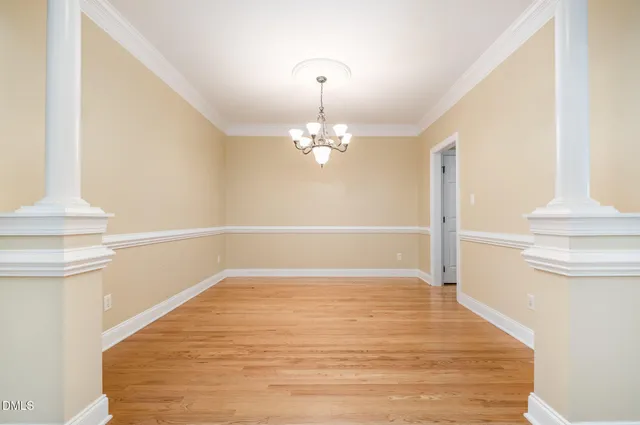 a view of entryway with wooden floor and stairs