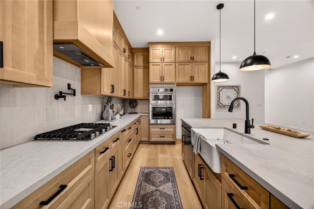 2210 Thornburg Road Paradise, CA 95969 - Photo 23 of 75 a kitchen with kitchen island stainless steel appliances a sink a stove and a wooden floors