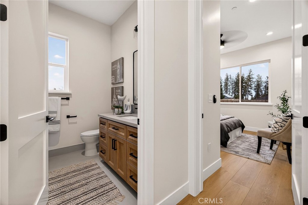 2210 Thornburg Road Paradise, CA 95969 - Photo 40 of 75 a bathroom with a toilet a sink and a mirror