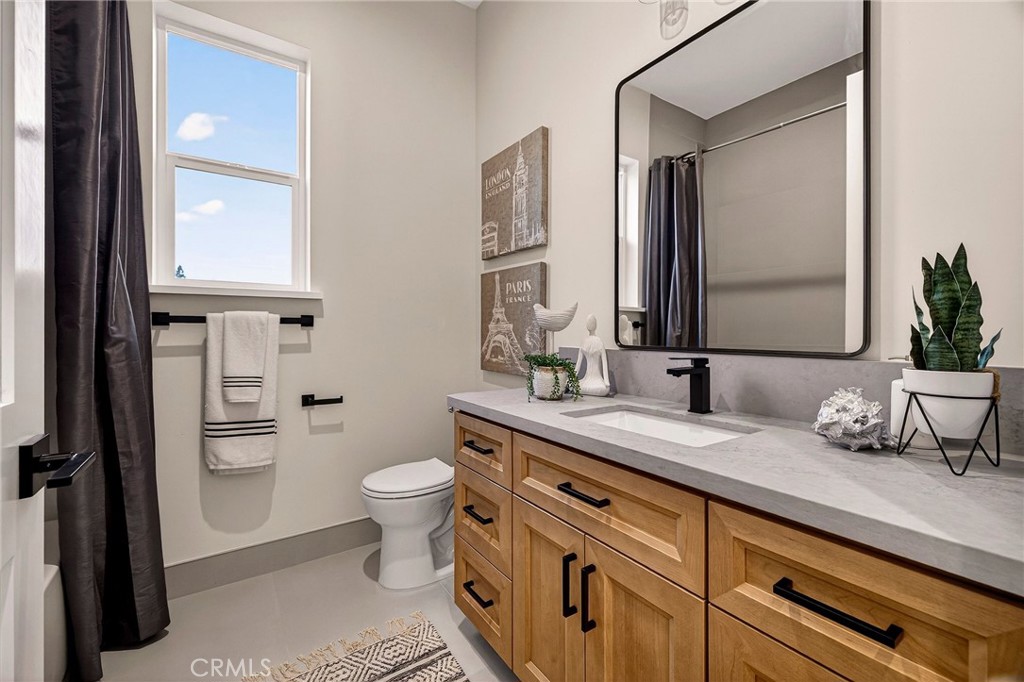 2210 Thornburg Road Paradise, CA 95969 - Photo 41 of 75 a bathroom with a granite countertop sink mirror and a toilet
