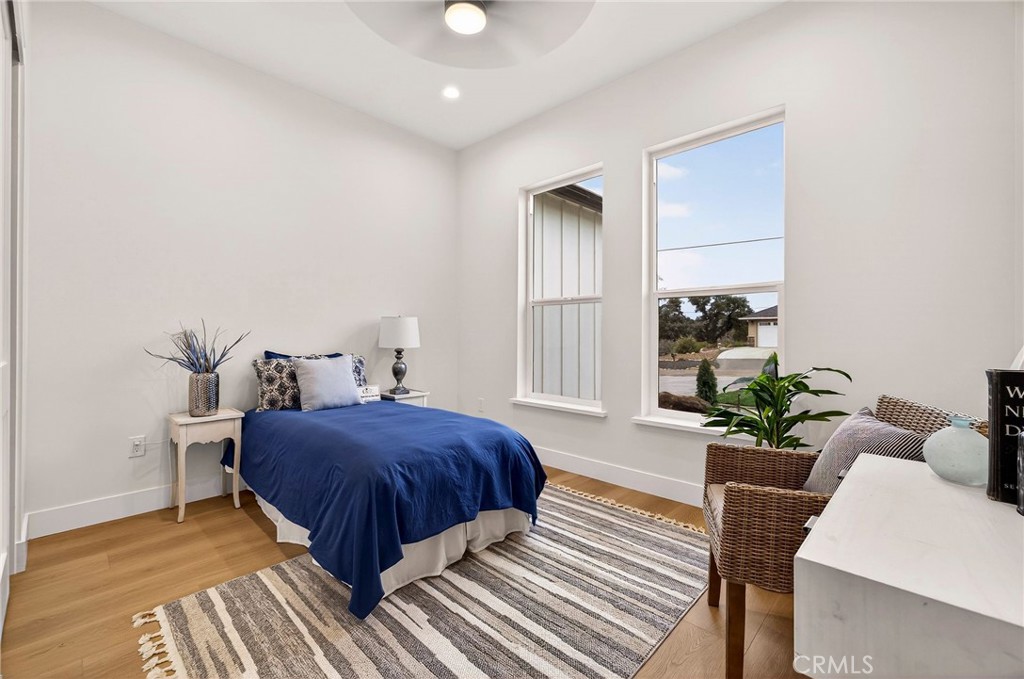 2210 Thornburg Road Paradise, CA 95969 - Photo 49 of 75 a bedroom with a bed and wooden floor